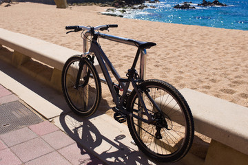 Fototapeta premium Bicycle standing near the beach. Ecological tourism. Summer sea