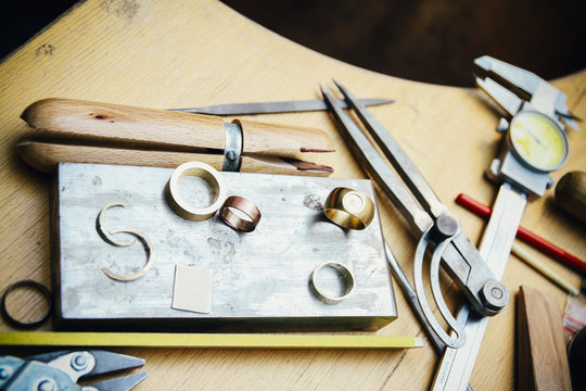 Tools and rings in workshop of a goldsmith