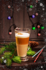 Latte macchiato - italian coffee beverage, Christmas card. Selective focus. Toned image