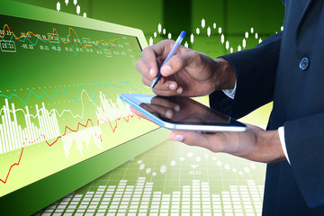 Fototapeta premium Business man calculating the digital tablet