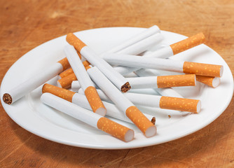 Many cigarettes on the plate