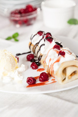 crepes with fruit and vanilla ice cream