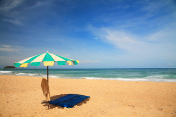 Colorful umbrella with bed sheet  at Phuket beach