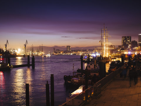 Germany, Hamburg, harbor and view of St. Pauli at night