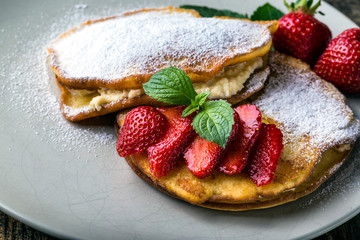 filled with homemade pancakes with strawberries
