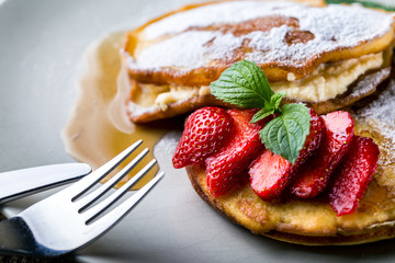 filled with homemade pancakes with strawberries