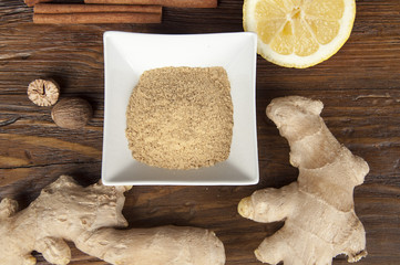 rhizome of ginger and spices on wooden table