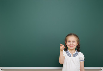 Schoolgirl near school board