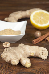rhizome of ginger and spices on wooden table
