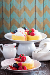 Pastry cups filled with cream and fresh berries