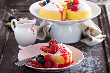 Pastry cups filled with cream and fresh berries