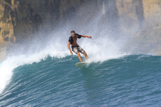 Indonesia, Lombok Island, surfing man