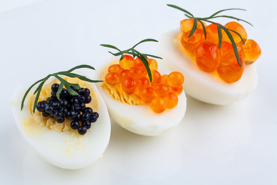 Salmon, trout and sturgeon caviar served on quail eggs