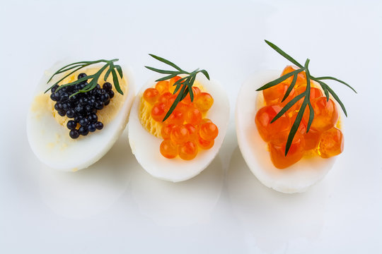 Trout, salmon and sturgeon caviar served on quail eggs