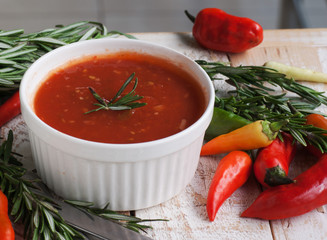 bowl of tomato hot sauce with peppers