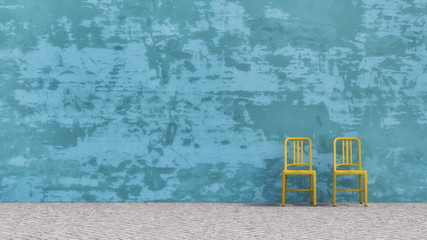 Two yellow chairs standing in front of blue concrete wall, D Rendering