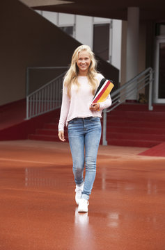 Happy blond teenage girl