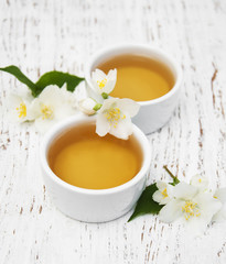 Cup of tea with jasmine flowers
