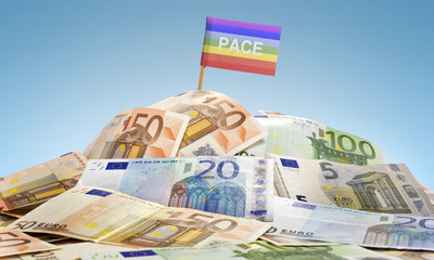 Flag of Peace sticking in a pile of various european banknotes.(