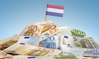 Flag of Netherlands sticking in a pile of various european bankn