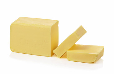 Stick of butter, cut, isolated on white