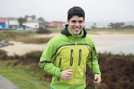 Spain, Valdovino, portrait of smiling jogger