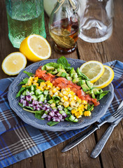 Salmon, avocado, corn, cucumber and onion salad