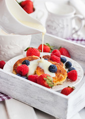 Cheese pancakes with fresh berries