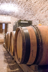 oak casks full of wine in a cellar of Burgundy