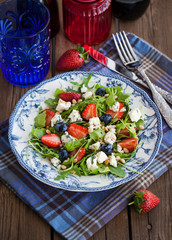 Arugula, strawberry, blueberry and blue cheese salad