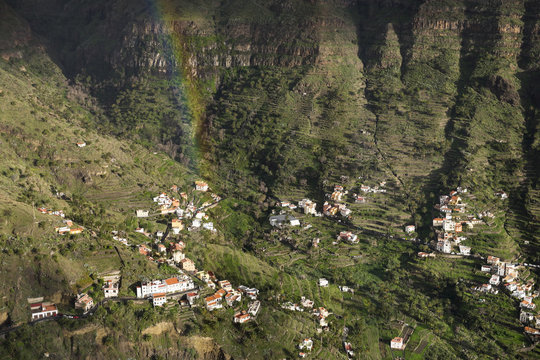 Spain, Canary Islands, La Gomera, Valle Gran Rey, View from Mirador Cesar Manrique, rainbow over village