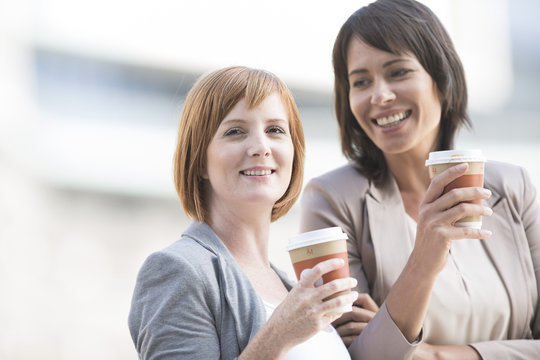 Businesswomen taking a break, drinking coffee