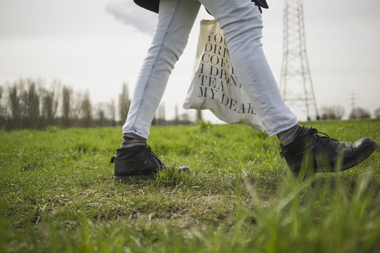 Germany, Zons, woman walking on a meadow
