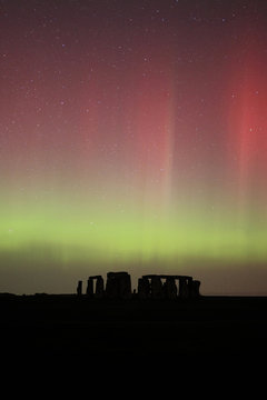 Great Britain, England, Stonehenge at night, green and red aurora