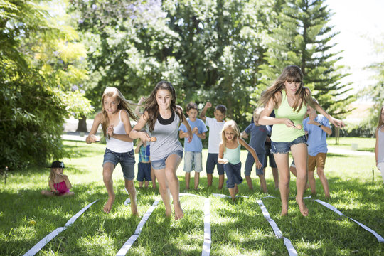 Girls competing in an egg-and-spoon race