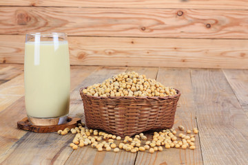 Glass with Soy Milk and Seeds on wooden background