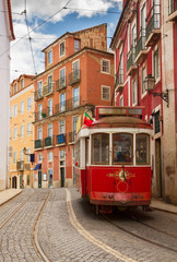 Naklejka na ściany i meble tram on narrow street of Alfama, Lisbon
