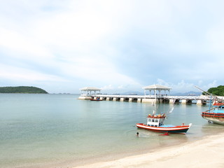 fishing boat and wood waterfront pavilion, at Koh si chang island in Thailand