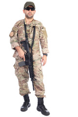 Full length portrait of young man in army clothes holding a weap