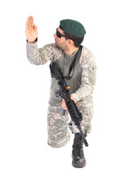 Portrait of soldier or commander holding his rifle and making si