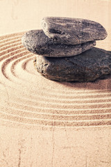Fototapeta na wymiar zen still life for spa and massage with sand and stones for relaxation and meditation with textured and contrast effects