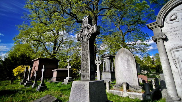 statues, crosses and tumbs in a cemetery