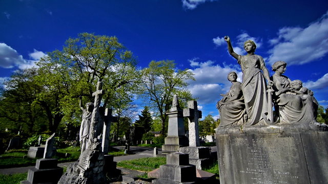 statues, crosses and tumbs in a cemetery