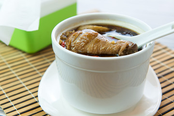 Double boiled chicken congee with mixed herb
