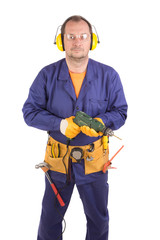 Worker in hard hat holding drill.