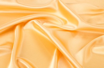 Close up of golden silk cloth texture.