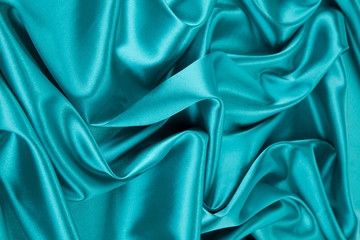 Blue silk cloth texture closeup.