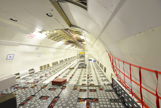 Interior of an unfinished airplane in a hangar