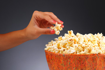 Woman's Hand and Popcorn Bowl