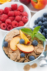 whole-grain flakes with fresh fruit and berries, close-up